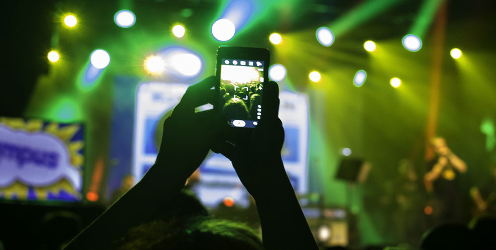 Image of cell phones at concert